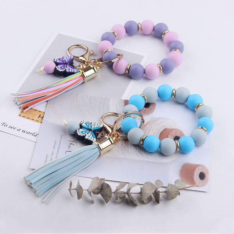 Wholesale PU Tassel Beaded Cartoon Butterfly Pendant Rainbow Leather Keychain